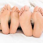 two pairs of bare feet