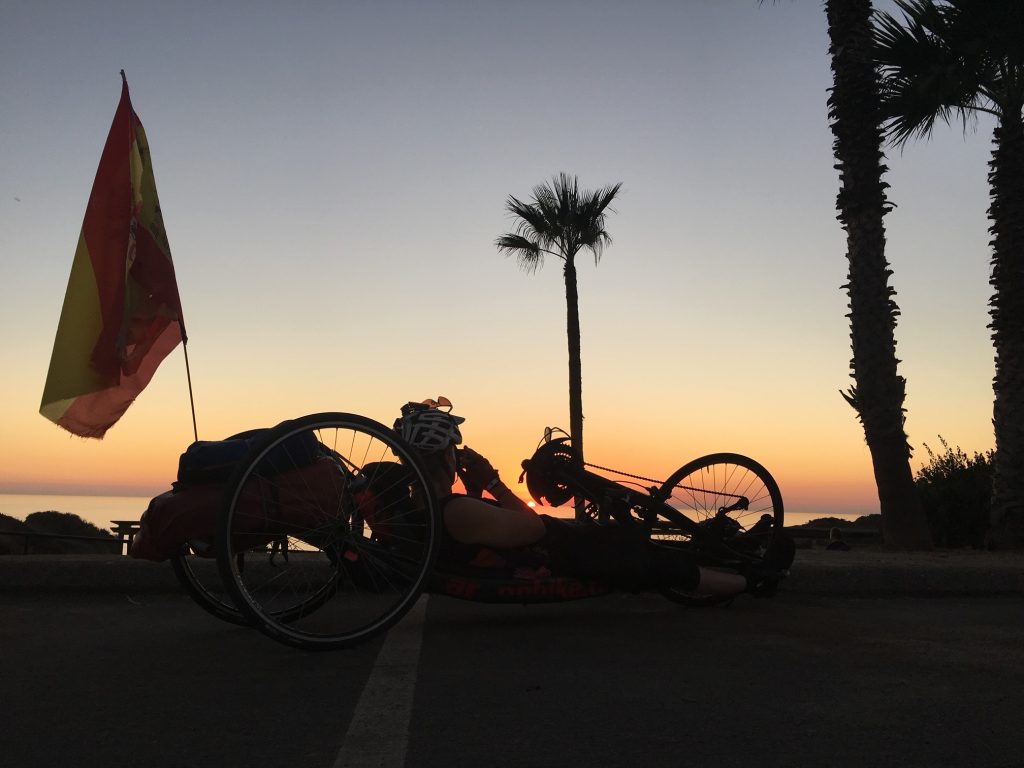 handcycling in front of sunset
