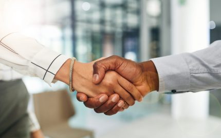 Two people shaking hands.