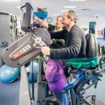SCI patient undergoing activity based rehabilitation in gym