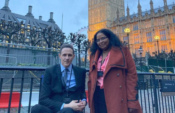 Glyn and Dharshana outside the Houses of Parliament