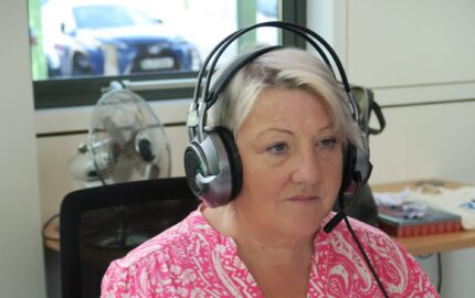 Teresa Skinner SIA support line with headphones on