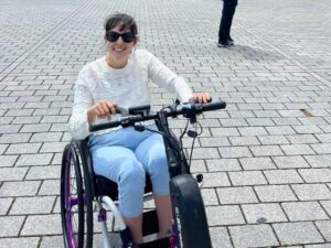 lou-tempest-berlin holiday photo using attachment on front of wheelchair