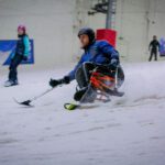 Skier using accessible ski equipment