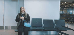 Screenshot SIA member Gaynor sat in waiting lounge at airport