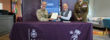 Armed Forces Covenant signing. SIA CEO Nik Hartley with two local armed forces members