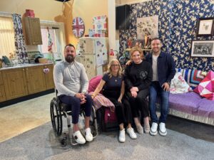 Martin Hibbert and wife on coronation street set with characters Tyrone and Fizz