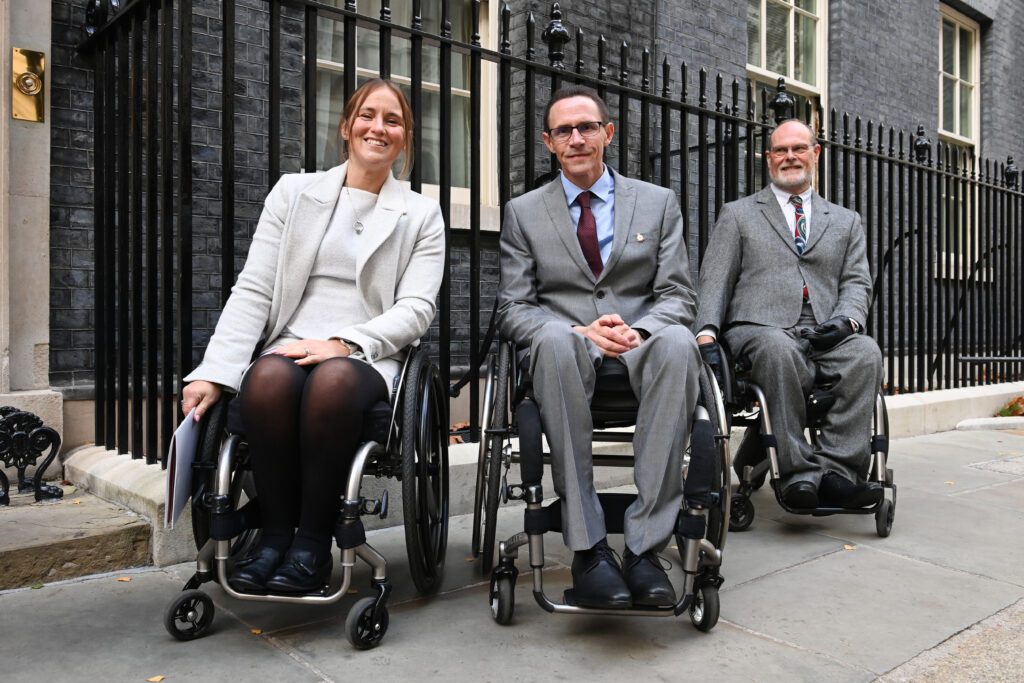 SIA at 10 Downing Street London. Showing three wheelchair users smiling