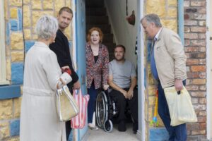 Coronation Street Tyrone in wheelchair at doorway of home