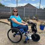 Female wheelchair user using Invictus equipment