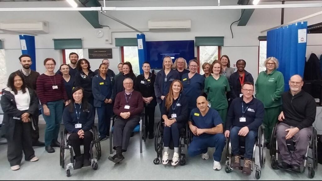 Members of SIA's clinicians team and support network team with spinal centre staff